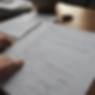 Close-up of a person reviewing financial documents