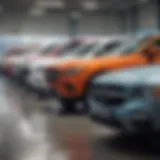 A diverse selection of vehicles lined up at a down car dealership