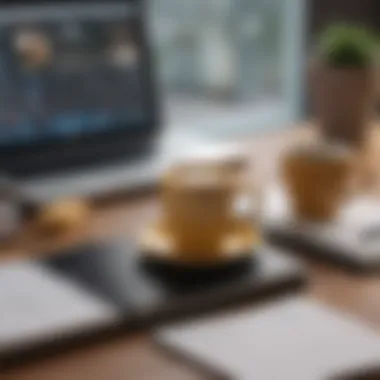 A notebook with a cup of coffee and a laptop on a desk